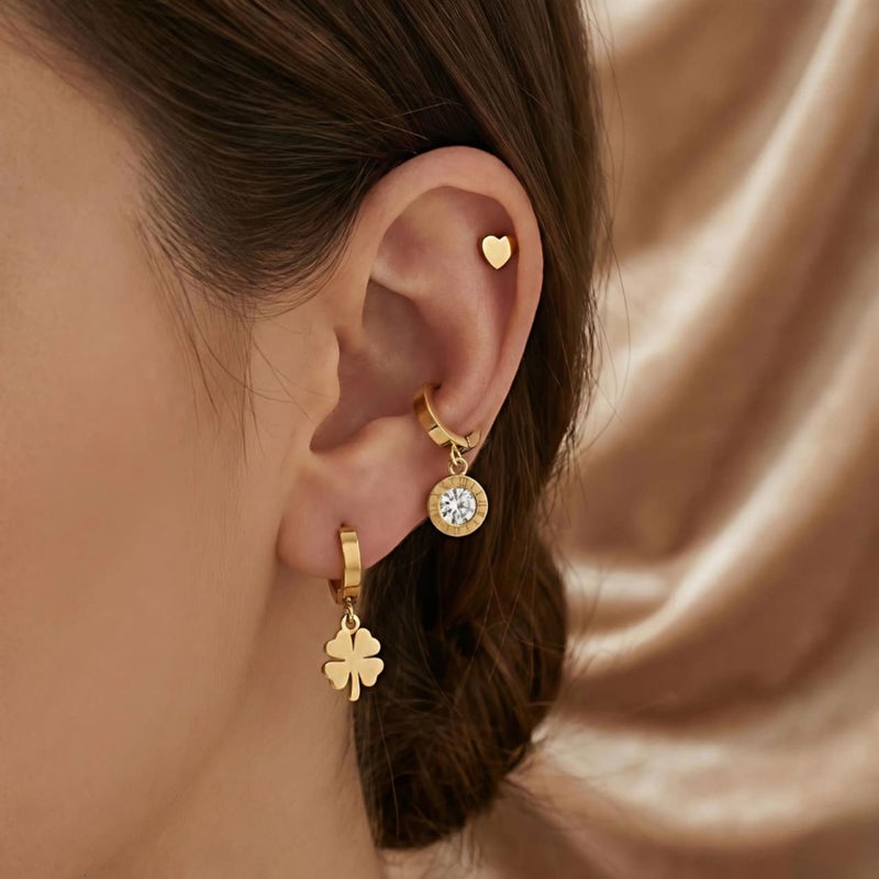A set of three pairs of gold earrings; combining a delicate heart-shaped design, dangling circles with sparkling zircon stones, and a charming dangling rose. Made of durable stainless steel for a unique look. - Image 3